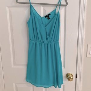 Turquoise sundress perfect for beach vacation. Size: M
